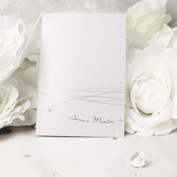 Wedding invitation with shiny silver embossing string adorned with rhinestones